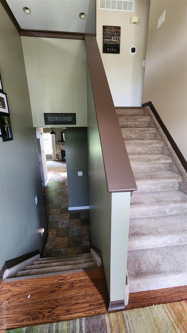 29390 Juniper St, Trenton, MI 48183 - stairway with stone finish flooring and a fireplace