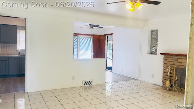 23930 Eureka Ave, Warren, MI 48091 - unfurnished living room featuring ceiling fan and a fireplace
