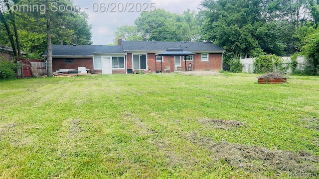 23930 Eureka Ave, Warren, MI 48091 - rear view of house featuring brick siding and a chimney