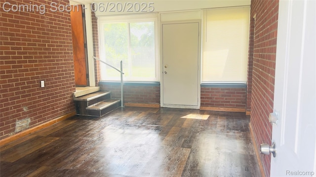 23930 Eureka Ave, Warren, MI 48091 - foyer entrance with wood finished floors and brick wall