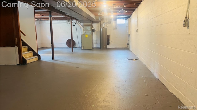 23930 Eureka Ave, Warren, MI 48091 - basement with heating unit, stairs, gas water heater, and concrete block wall