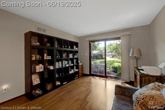 7190 Pebble Park Dr, West Bloomfield, MI 48322 - sitting room with wood finished floors