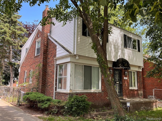 21421 Bournemouth St, Taylor, MI 48225 - view of property exterior featuring a chimney and brick siding
