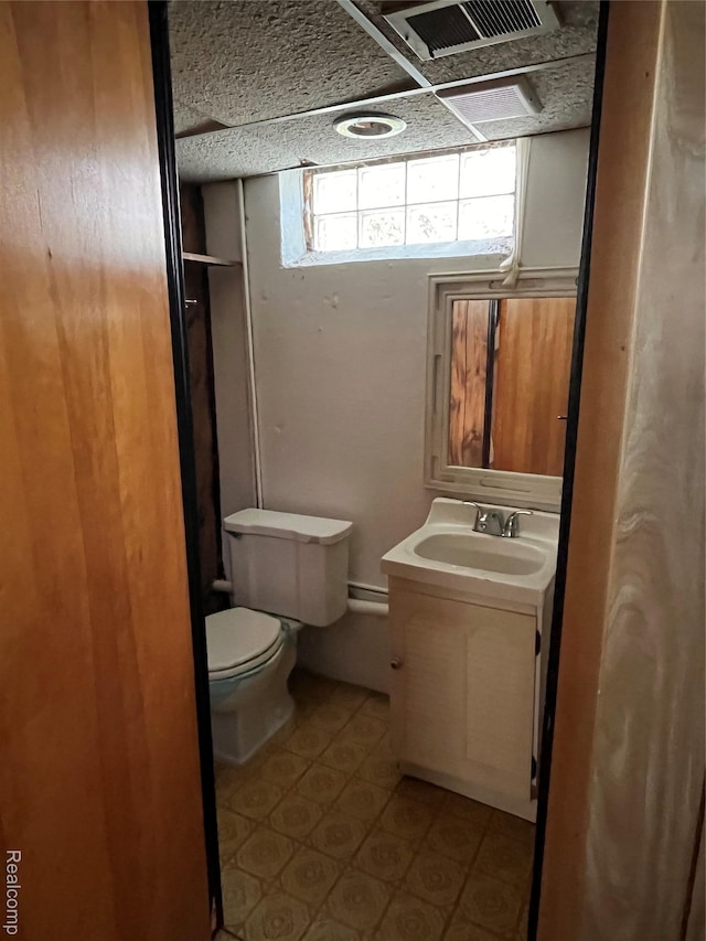 21421 Bournemouth St, Taylor, MI 48225 - bathroom featuring vanity, tile patterned floors, a baseboard heating unit, and a shower
