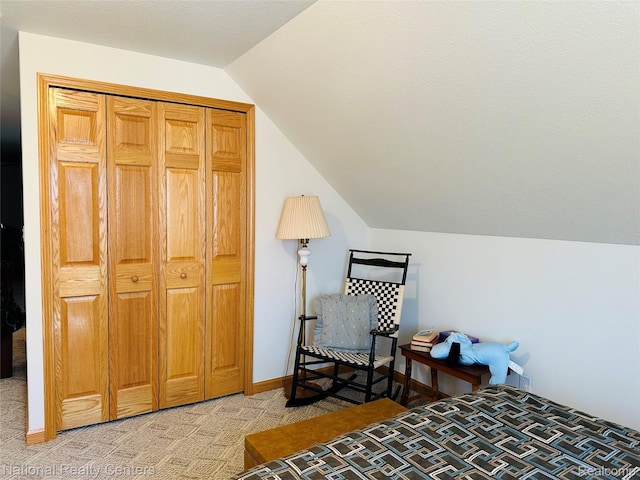1390 N US-23, East Tawas, MI 48730 - bedroom featuring lofted ceiling and light colored carpet