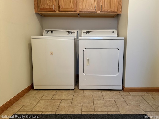 1390 N US-23, East Tawas, MI 48730 - laundry area with independent washer and dryer, stone tile floors, and cabinet space