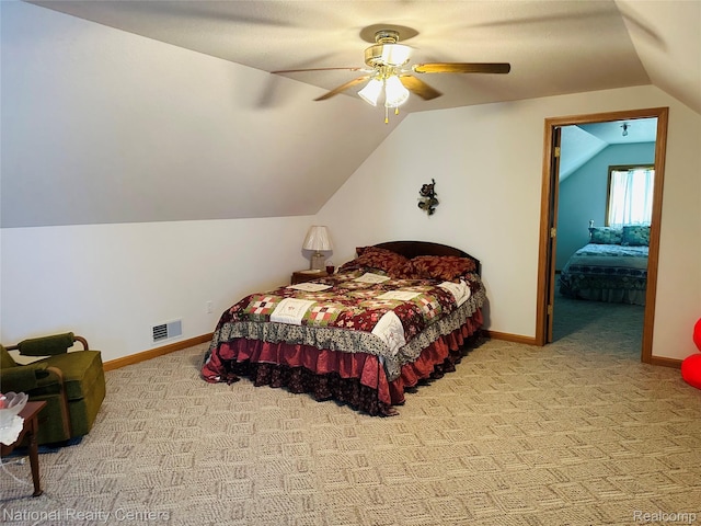 1390 N US-23, East Tawas, MI 48730 - bedroom featuring carpet flooring, vaulted ceiling, and a ceiling fan