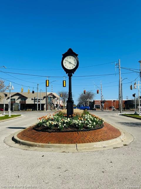 1390 N US-23, East Tawas, MI 48730 - view of asphalt road with traffic lights, curbs, street lights, and traffic signs