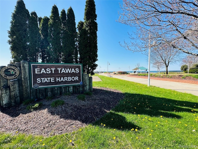 1390 N US-23, East Tawas, MI 48730 - community / neighborhood sign featuring a yard