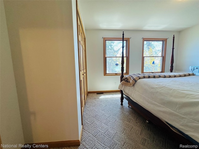 1390 N US-23, East Tawas, MI 48730 - bedroom with baseboards and carpet