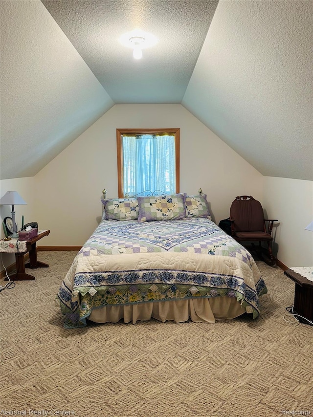 1390 N US-23, East Tawas, MI 48730 - carpeted bedroom featuring a textured ceiling and vaulted ceiling