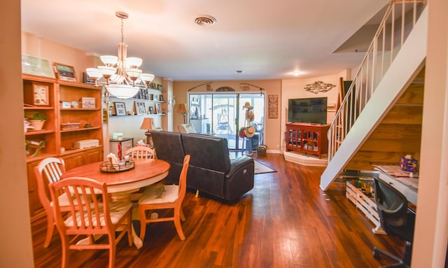 61626 Colony Bay Dr Unit 15, Cassopolis, MI 49031 - dining room featuring a chandelier, wood finished floors, and stairs