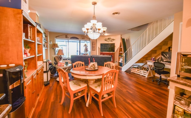 61626 Colony Bay Dr Unit 15, Cassopolis, MI 49031 - dining room featuring a chandelier, wood finished floors, and stairs