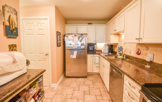 61626 Colony Bay Dr Unit 15, Cassopolis, MI 49031 - kitchen with appliances with stainless steel finishes, tasteful backsplash, dark stone counters, and white cabinetry