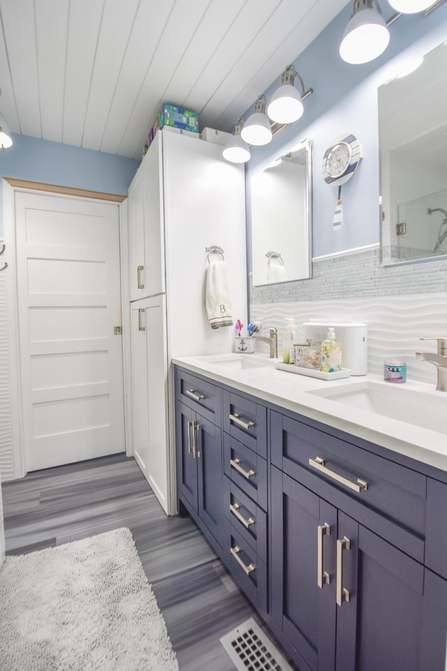 61626 Colony Bay Dr Unit 15, Cassopolis, MI 49031 - bathroom featuring double vanity and wood finished floors