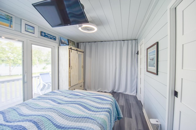 61626 Colony Bay Dr Unit 15, Cassopolis, MI 49031 - bedroom featuring access to outside, dark wood-style flooring, wooden ceiling, and wood walls