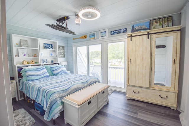 61626 Colony Bay Dr Unit 15, Cassopolis, MI 49031 - bedroom featuring access to outside, wooden ceiling, dark wood-style floors, a ceiling fan, and a barn door