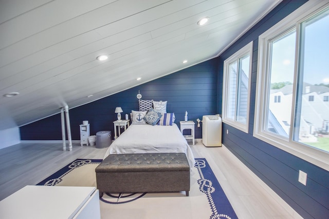 61626 Colony Bay Dr Unit 15, Cassopolis, MI 49031 - bedroom featuring vaulted ceiling, multiple windows, light wood-type flooring, wooden walls, and recessed lighting