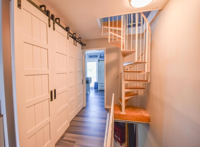 61626 Colony Bay Dr Unit 15, Cassopolis, MI 49031 - corridor featuring a barn door and wood finished floors