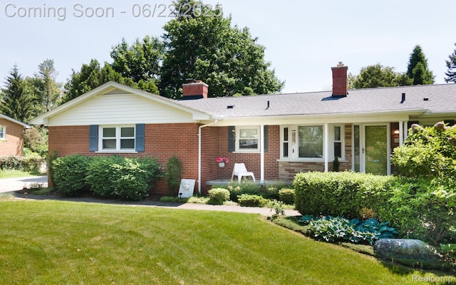 17417 Wiltshire Blvd, Lathrup Village, MI 48076 - ranch-style home with a chimney, brick siding, and a front yard