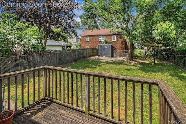 2061 E Boatfield Ave, Burton, MI 48529 - deck with a fenced backyard and a storage unit