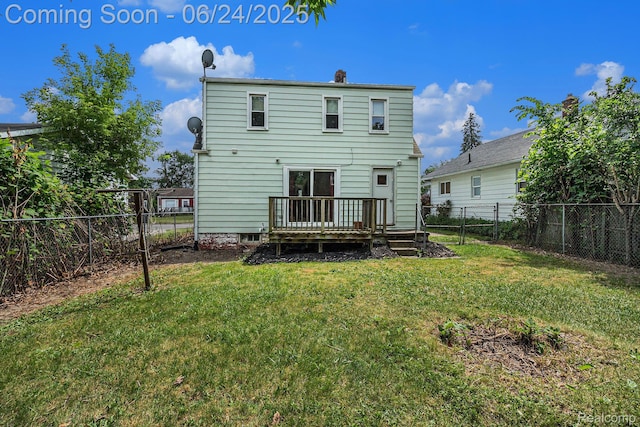2061 E Boatfield Ave, Burton, MI 48529 - back of property with a fenced backyard, a wooden deck, and a chimney