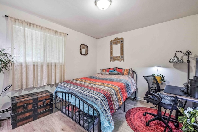 10660 E Holly Rd, Davisburg, MI 48350 - bedroom featuring wood finished floors and a desk