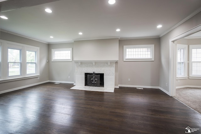 901 Chicago Blvd, Detroit, MI 48202 - unfurnished living room featuring crown molding, a premium fireplace, dark wood-type flooring, and recessed lighting