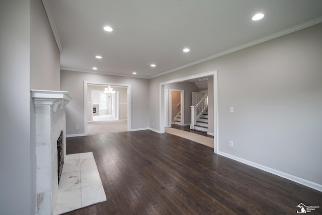 901 Chicago Blvd, Detroit, MI 48202 - unfurnished living room featuring stairway, crown molding, wood finished floors, a tiled fireplace, and recessed lighting