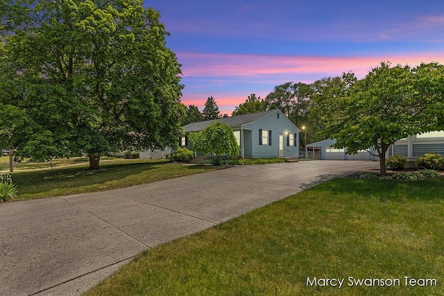 1372 Brookmark St SE, Kentwood, MI 49508 - view of front of property featuring a lawn and a detached garage