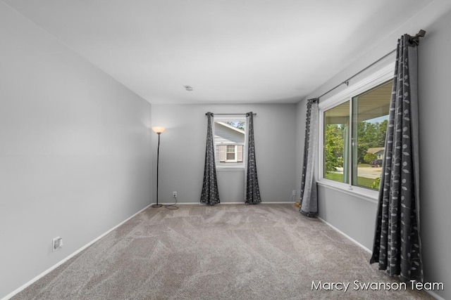 1372 Brookmark St SE, Kentwood, MI 49508 - empty room featuring carpet flooring and baseboards