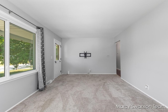 1372 Brookmark St SE, Kentwood, MI 49508 - carpeted spare room featuring baseboards