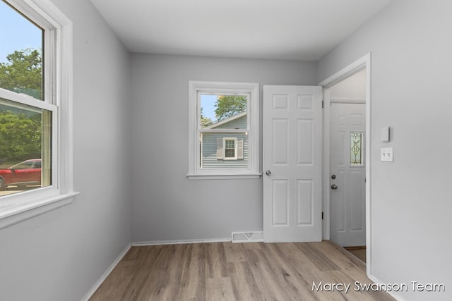 1372 Brookmark St SE, Kentwood, MI 49508 - unfurnished bedroom with wood finished floors and baseboards