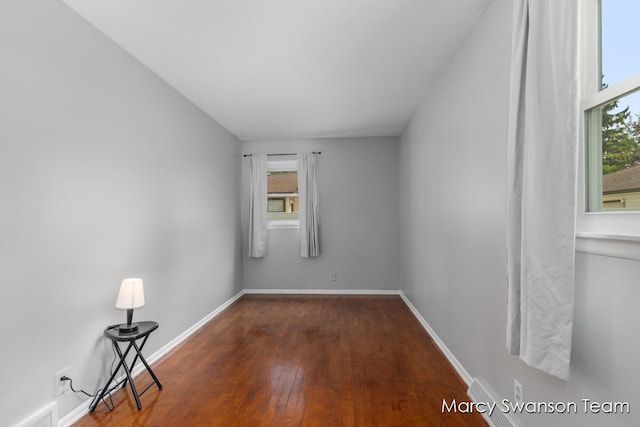 1372 Brookmark St SE, Kentwood, MI 49508 - empty room featuring wood finished floors and healthy amount of natural light