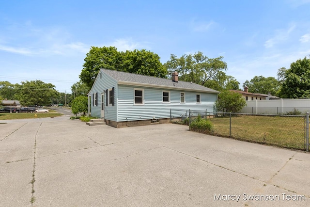 1372 Brookmark St SE, Kentwood, MI 49508 - view of front facade featuring a chimney