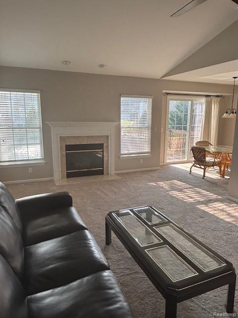5959 Augusta Ln Unit 20, Grand Blanc, MI 48439 - carpeted living area with a premium fireplace and lofted ceiling