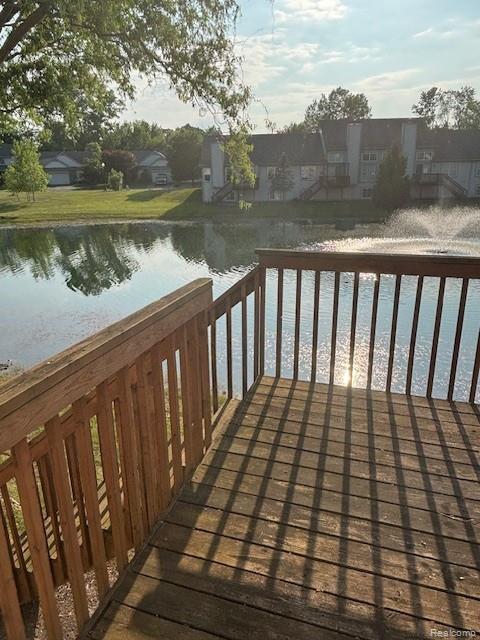5959 Augusta Ln Unit 20, Grand Blanc, MI 48439 - wooden terrace with a water view and a residential view