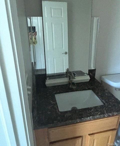 5959 Augusta Ln Unit 20, Grand Blanc, MI 48439 - bathroom featuring toilet and vanity