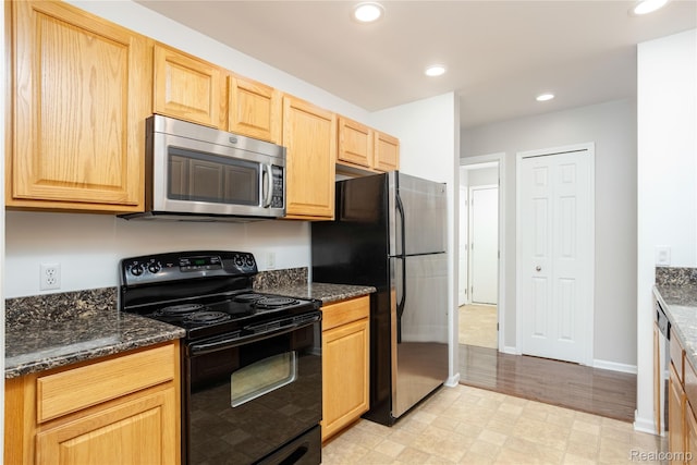 5959 Augusta Ln Unit 20, Grand Blanc, MI 48439 - kitchen featuring appliances with stainless steel finishes, light brown cabinets, recessed lighting, dark stone countertops, and light flooring
