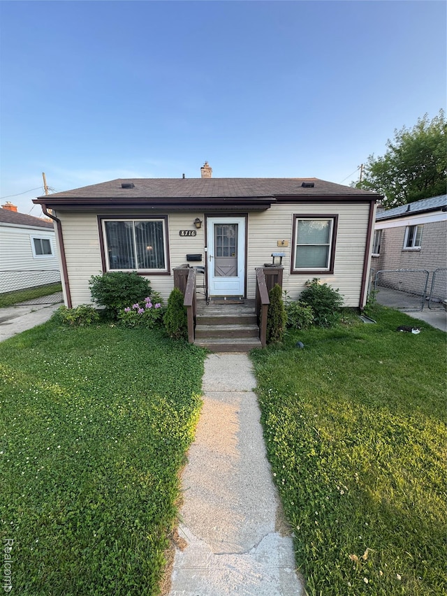 8716 Essex Ave, Warren, MI 48089 - view of front of home with a chimney