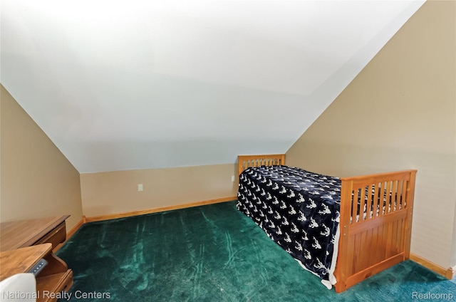 1471 Eldon Ct, Gladwin, MI 48624 - carpeted bedroom with vaulted ceiling and baseboards