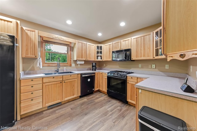 1471 Eldon Ct, Gladwin, MI 48624 - kitchen featuring black appliances, light brown cabinets, light wood-style flooring, light countertops, and recessed lighting