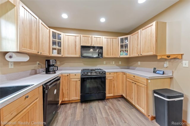 1471 Eldon Ct, Gladwin, MI 48624 - kitchen with black appliances, light brown cabinetry, light wood-style flooring, glass insert cabinets, and recessed lighting