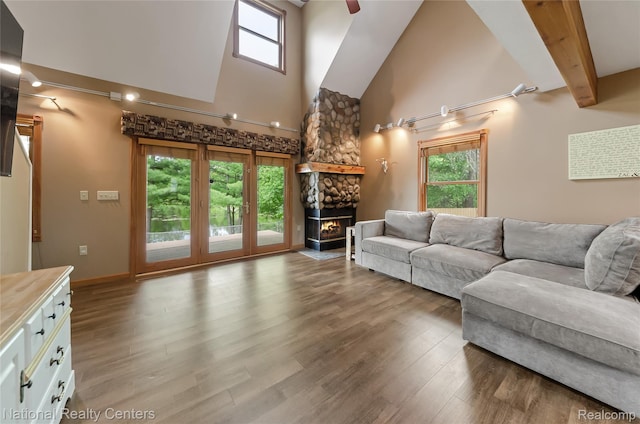 1471 Eldon Ct, Gladwin, MI 48624 - living area featuring high vaulted ceiling, wood finished floors, healthy amount of natural light, and ceiling fan