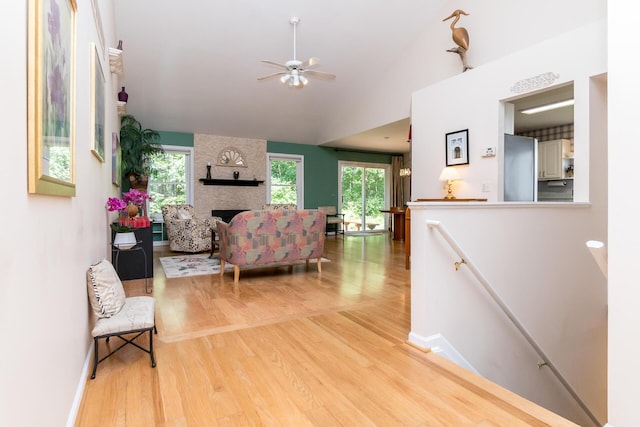 3105 Earlmoore Ln, Ann Arbor, MI 48105 - living room featuring wood finished floors, healthy amount of natural light, a ceiling fan, and vaulted ceiling