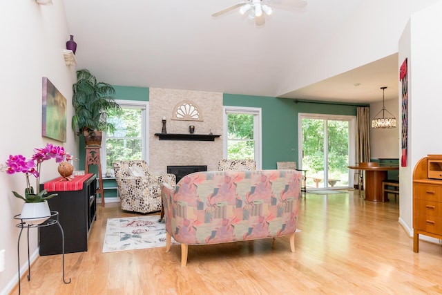 3105 Earlmoore Ln, Ann Arbor, MI 48105 - living room with wood finished floors, healthy amount of natural light, a fireplace, and ceiling fan