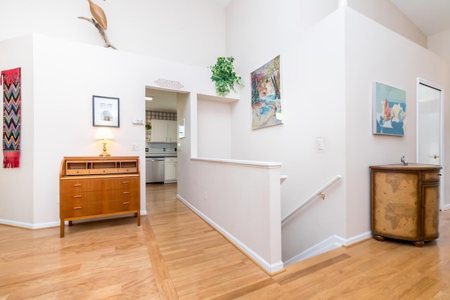 3105 Earlmoore Ln, Ann Arbor, MI 48105 - corridor featuring light wood-type flooring, an upstairs landing, and a high ceiling
