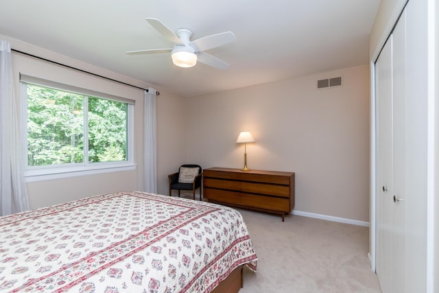 3105 Earlmoore Ln, Ann Arbor, MI 48105 - bedroom featuring a closet, light carpet, and ceiling fan
