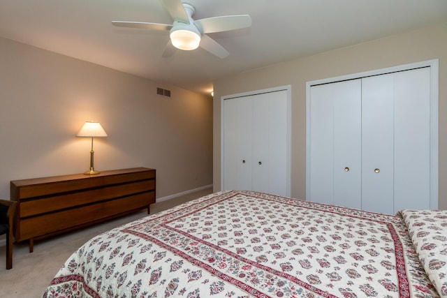 3105 Earlmoore Ln, Ann Arbor, MI 48105 - bedroom with two closets, carpet, and ceiling fan