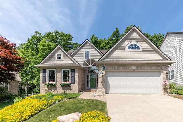 3105 Earlmoore Ln, Ann Arbor, MI 48105 - view of front of property with concrete driveway, brick siding, and a garage